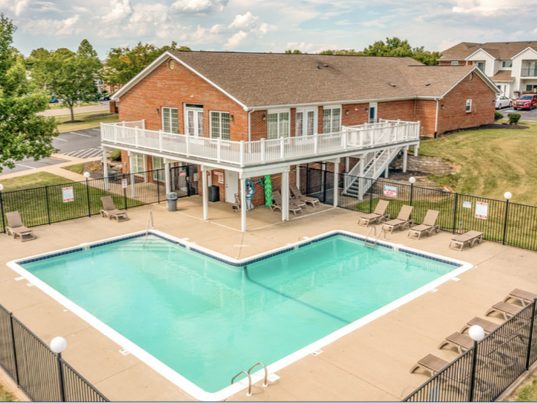 Pool and clubhouse at a garden-style apartment community in Hamilton, Ohio