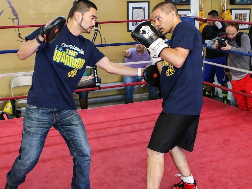 Ian coaching a boxer in the ring at Dreamland Boxing