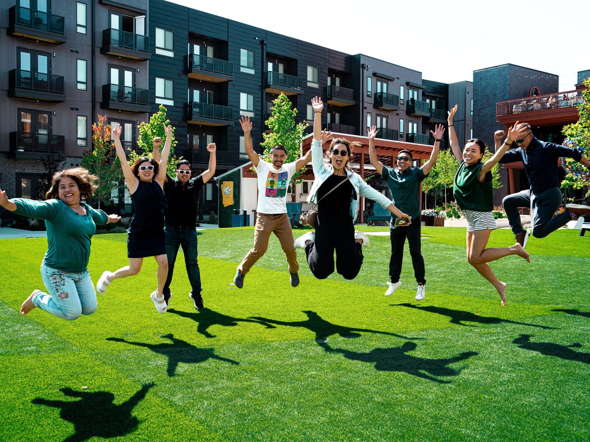 Cincinnati Investors Field Trip attendees in front of an apartment building