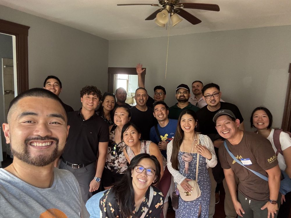 Field trip attendees gathered in a Cincinnati apartment during a tour
