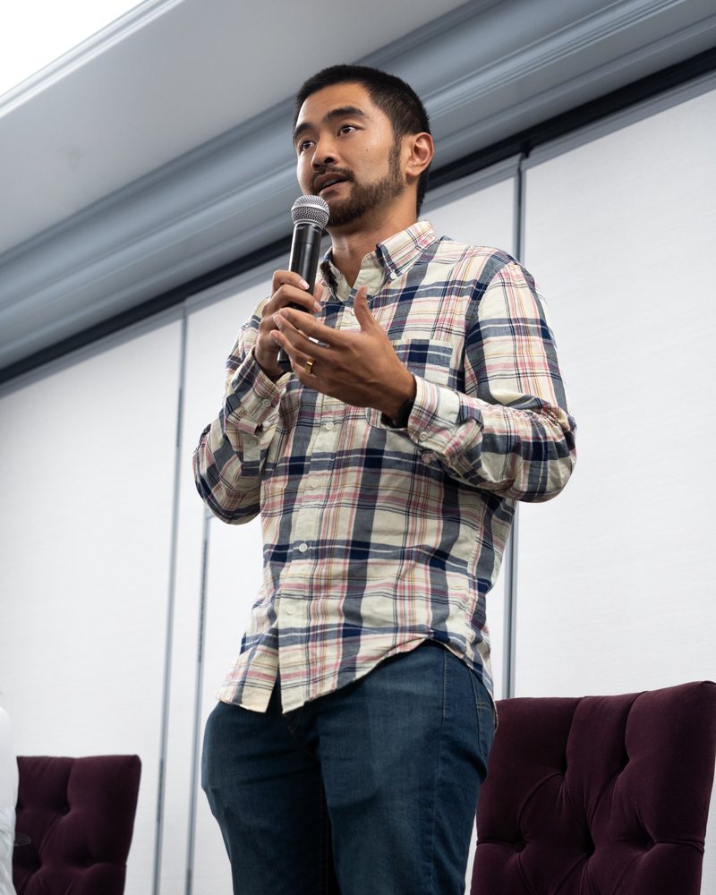 Ian Cruz speaking on stage